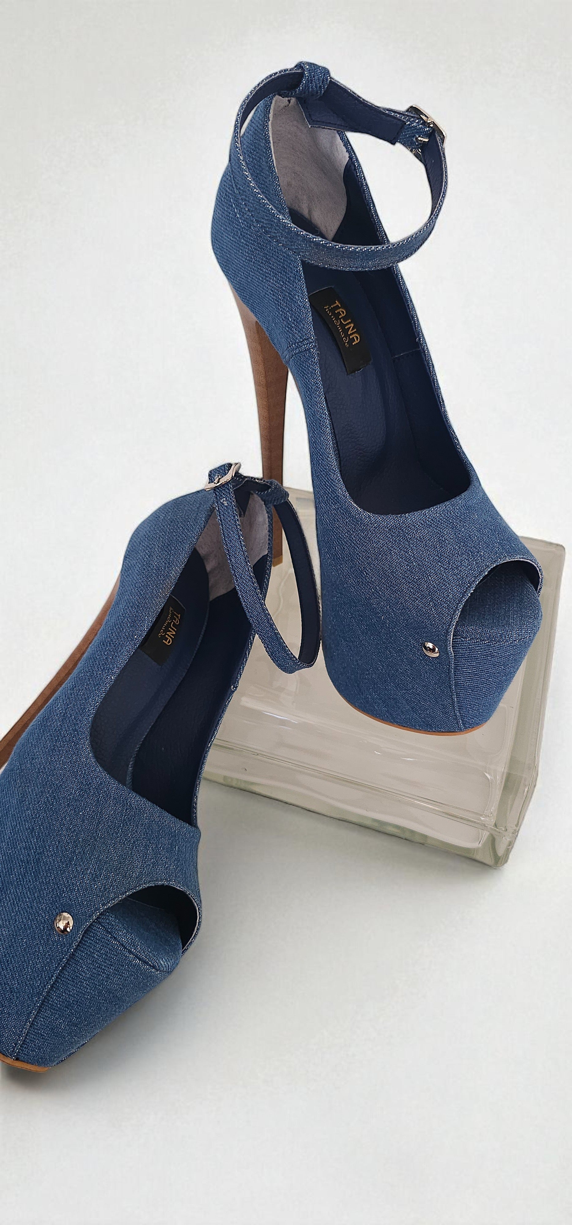 Blue open-toe high-heeled shoes on a white background