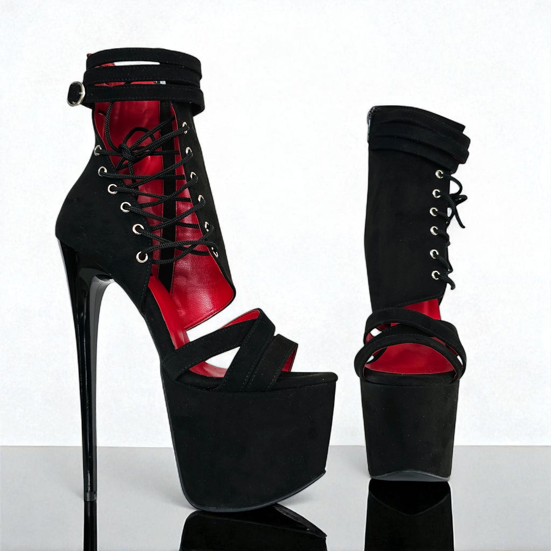 Black and red high-heeled platform shoes on a white background