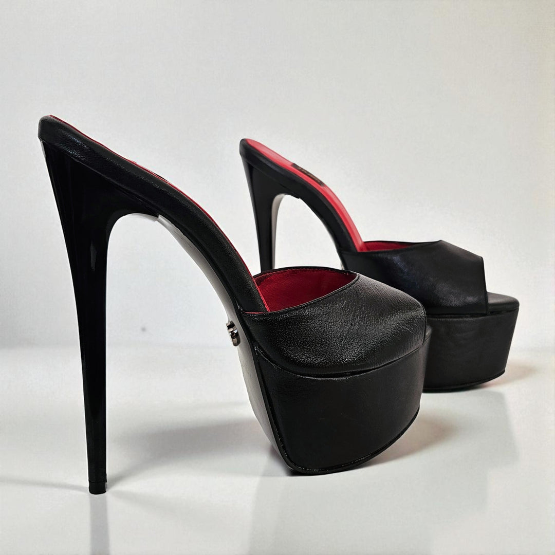 Black high-heeled platform shoes with red interior on a white background