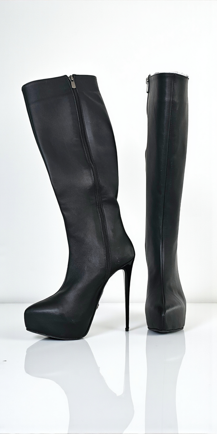 Black knee-high boots with high heels on a white background