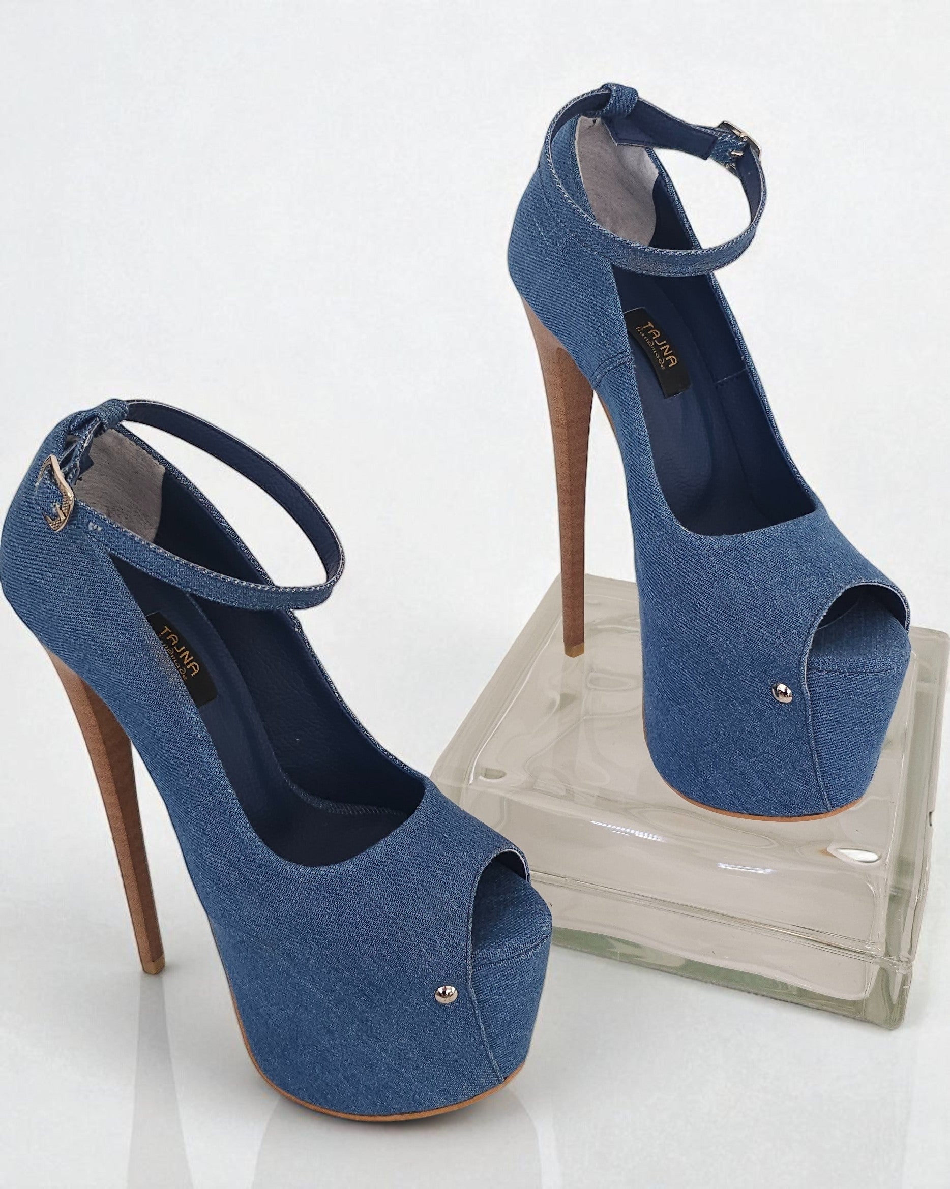 Blue high-heeled shoes with open toes on a white background