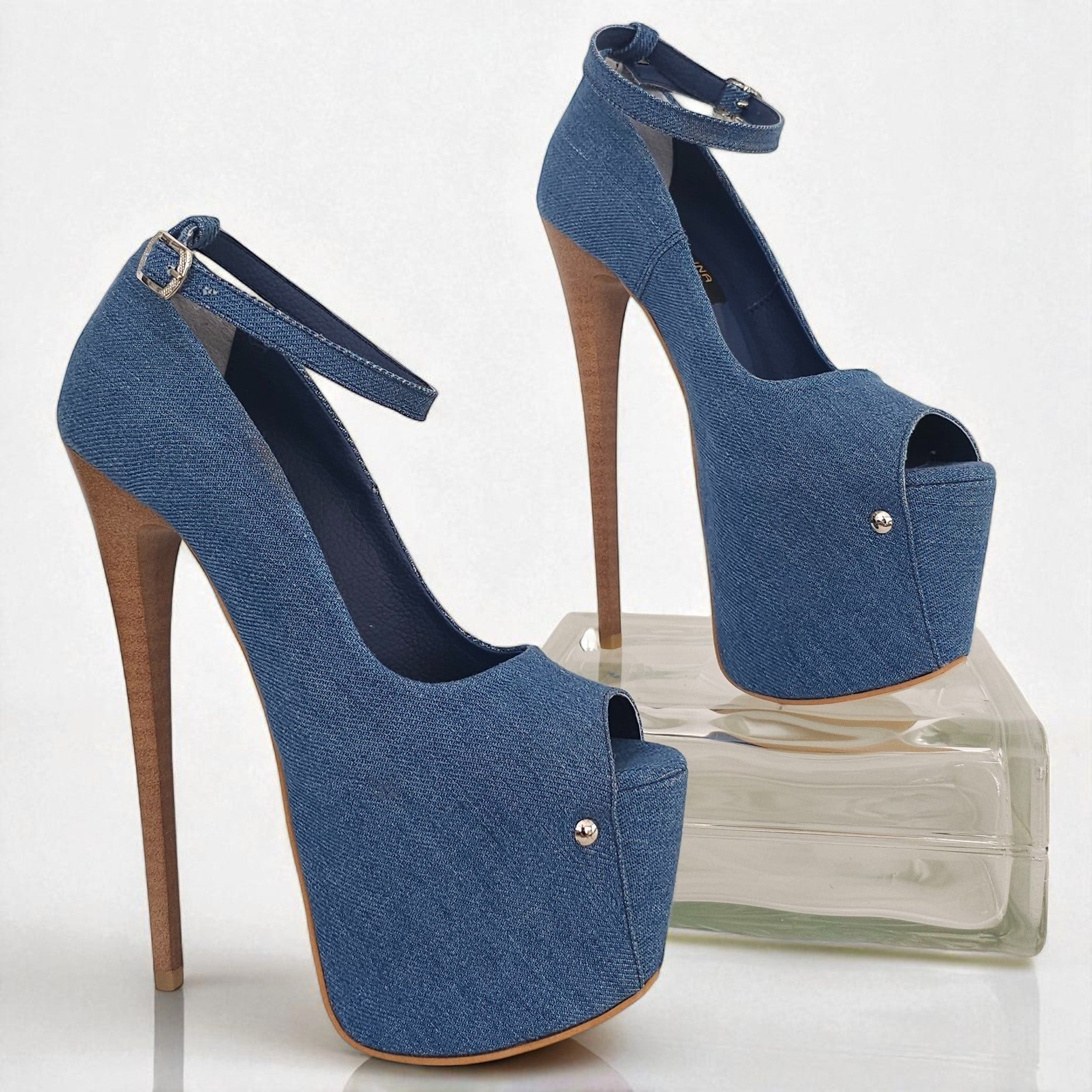 Blue high-heeled shoes with open toes on a white background